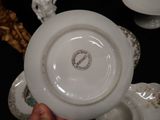 a person holding a white plate with a picture on it