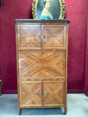 a dresser with a painting on top of it in a room