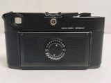 a black camera that is sitting on a table