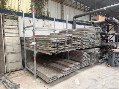 a large pile of metal items in a warehouse