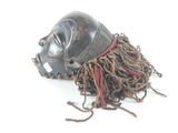 an image of a mask with dreadlocks on a white background