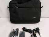 a black bag with a charger and a mouse in it