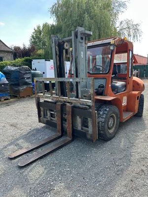 an image of a forklift parked in a parking lot