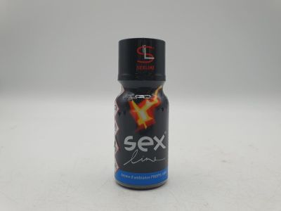a close up of a bottle of sex on a white surface
