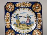 un gros plan d'une assiette sur laquelle figure l'image d'un homme et d'une femme