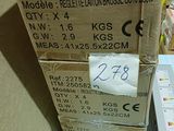 a stack of boxes sitting on a table with a price tag on it