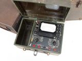a box with a radio inside of it on a white surface
