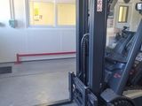 a picture of a forklift parked in a warehouse