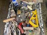 a box full of tools sitting on the floor