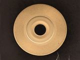 a picture of a black and white photo of a gold plate