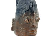 an image of a statue of a man with a hat on top of his head