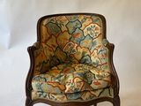 an image of a chair with a floral upholstered seat