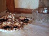 a plate with a face on it next to a glass of water