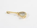 a close up of a gold plated spoon with a stone in it