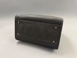 a black leather wallet with gold hardware on the front