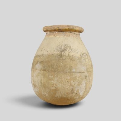 an old vase that is sitting on a table