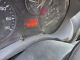 a close up of a car dashboard with a speedometer