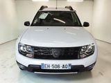 the front of a white dacia parked in a garage