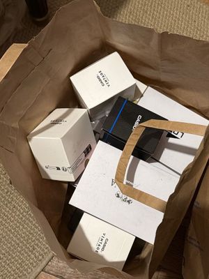 a brown paper bag with a bunch of boxes inside of it