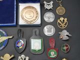 a lot of military badges and medals on a table