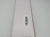the back of a white box on a white surface with a barcode on it