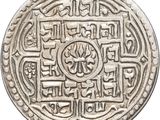 a close up of a silver coin on a white background