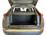 the back of a car with its trunk open and the back of the car in the back