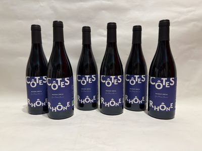 six bottles of wine sitting on top of a white table