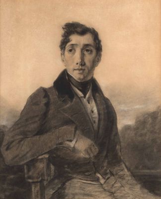 portrait of a man in a suit and tie sitting on a chair