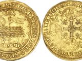 a gold coin with a cross on the front and a cross on the back