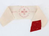 a piece of cloth with a red patch on it