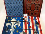 three books are lined up on a table with a red, white and blue cover