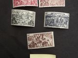 a group of stamps with a note attached to them sitting on a table