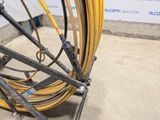 a yellow hose that is attached to the side of a building