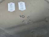 two tags on the bottom of a metal pot