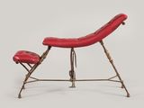 an image of a red leather chair with a foot rest