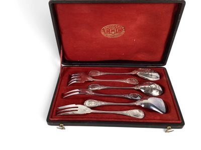 an image of a set of silverware in a red case