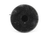 a black donut with a hole in it on a white surface