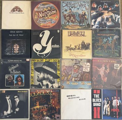 a lot of records on the wall of a room