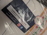 a bag of fabric that is wrapped in plastic