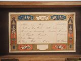 a picture of an old document in a wooden box