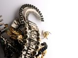 a close up of a brooch with black and white beads