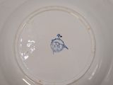a white plate with a blue design on it