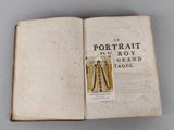 an open book with a picture of a man in a suit on it