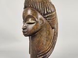 a close up of a sculpture of a woman ' s head