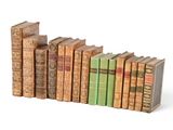 many old books stacked on top of each other