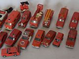 a lot of toy fire trucks that are on the table