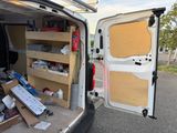 a white van with shelves in the back of it