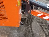 a close up of a machine that is working on the ground