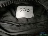 a label on the inside of a bag that says so